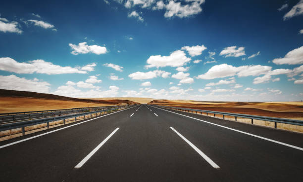 empty-highway-road-in-a-cloudy-summer-day.jpg